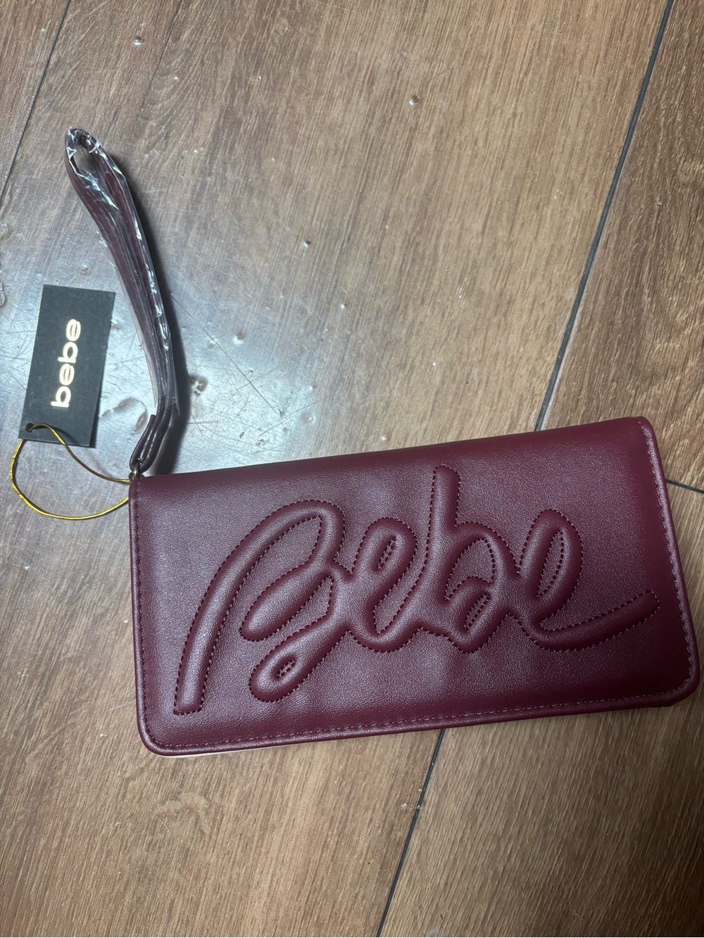 bebe Quilted Script Wristlet in Burgundy Wine